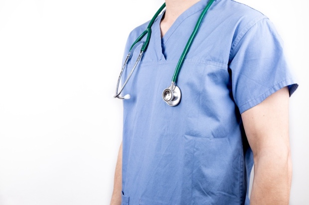 Medical professional wearing scrubs.